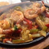 Shrimp and Chicken Fajitas · Large shrimp and chicken sauteed with peppers and onions.