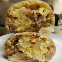 Breakfast Burrito · Choice of meat: Bacon, sausage, ham, or veggies made with 2 eggs, hashbrowns, and cheese.