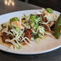 CARNITAS TACOS · Three tacos, pineapple pico, cabbage, poblano crema, cilantro