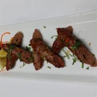 Lamb Seekh Kabab · Skewers of lamb mince rolls.