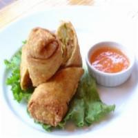 Spring Rolls · Crispy egg roll stuffed with shrimp and chicken.