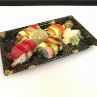 S1. Hudson Roll · 2 pieces of shrimp tempura inside, topped with tuna, salmon, whitefish, avocado, and eel sau...