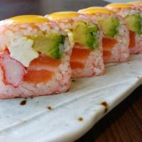 S7. Pink Lady Roll · Salmon, cream cheese, Kani, and avocado inside, wrapped with soybean paper, apricot aioli on...