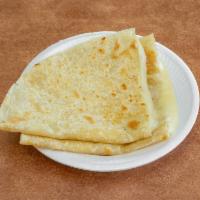 Plain Cheese Quesadilla · 10” flour tortilla, melted cheese. Toppings include; cilantro, onion guacamole and tomato ba...