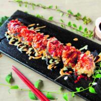 Crispy and Spicy Roll · Crabmeat, shrimp, asparagus with spicy tuna and mango, eel sauce, spicy mayo and tobiko.