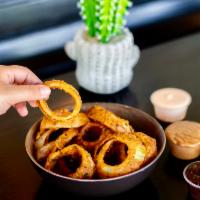 Regular Onion Rings · Served with a buttermilk-BBQ sauce.