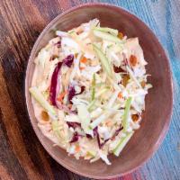 Regular Coleslaw · Red and white cabbage, carrots, diced apple, raisin, chia seeds and creamy vinaigrette.