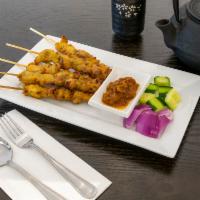 4. Satay · 5 sticks. Marinated beef or chicken on skewers, charcoal-grilled to perfection. Served with ...
