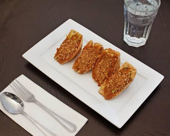 5. Satay Tofu · Crispy fried tofu stuffed with cucumber and bean sprout. Served with peanut sauce. Spicy.