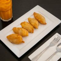 7. Malaysian Curry Puff · Pastry dough stuffed with chicken, onion, potato and curry powder. Spicy.