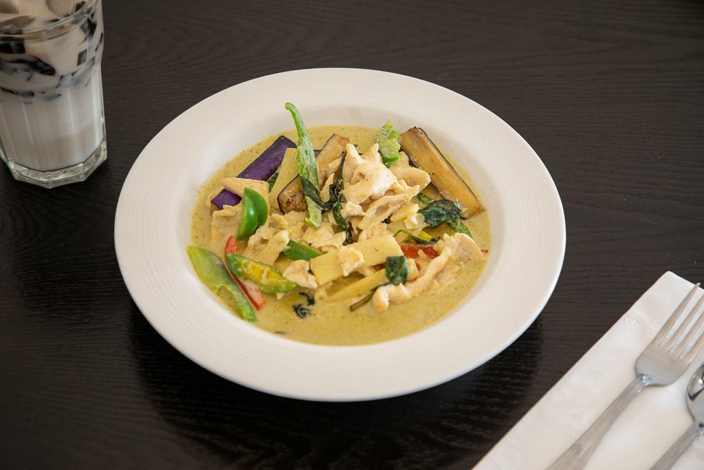 136. Thai Green Curry · Choice of chicken or beef with Thai eggplant, peppers, bamboo shoots, basil and lime leaves in a spicy coconut curry broth. Spicy.