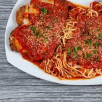 Chicken Parmigiana · Served with spaghetti and marinara.