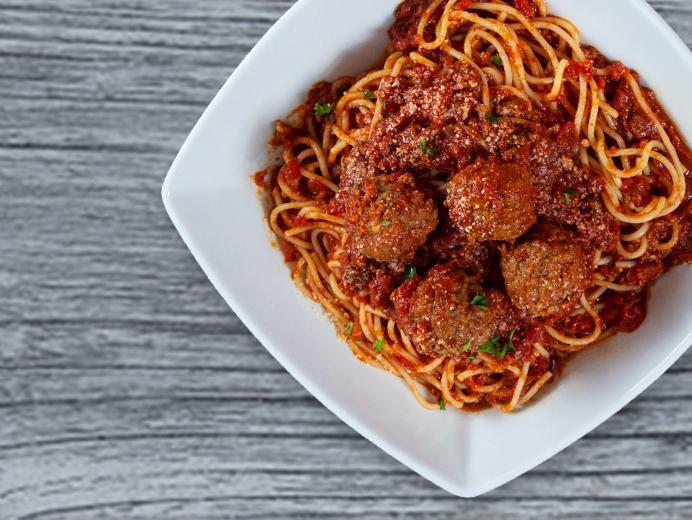 Spaghetti with Meatballs · Served with meat sauce and sprinkled with Parmesan cheese on top.