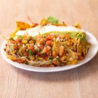 Super Nachos · Fresh chips topped with refried beans, Jack cheese, sour cream, guacamole and pico de gallo,...