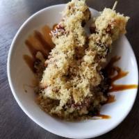 Skew Crunch Roll · Skewed deep fried California roll with teriyaki sauce and spicy mayo