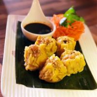 Steamed Shrimp and Chicken Dumpling · Great homemade style appetizer with mix of ground chicken and shrimp wrapped in yellow wonto...