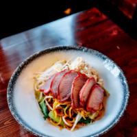Ba Mee Pooh Moo Dang · Egg noodle with roasted pork and jumbo lump crab meat, decorated with scallions and cilantro.