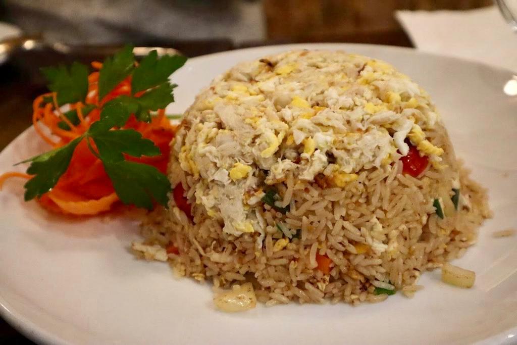 Crab Meat Fried Rice · Fried rice with fresh crab meat, tomatoes, onions, scallions and egg.