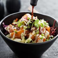 Fresh Salmon Bowl · Rice topped with sesame seeds, lettuce, edamame, cucumber, avocado, carrots, cabbage, beets,...
