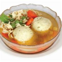 Matzo Ball Soup · Chicken soup with noodles, veggies and a matzo ball.