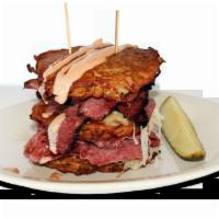 NYBB Pile Up Sandwich · 3 of our famous potato pancakes piled high with corned beef, pastrami, kraut, Swiss, and a d...
