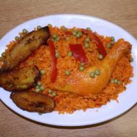 Cuban Arroz con Pollo · Yellow rice with chicken and fried plantains. 