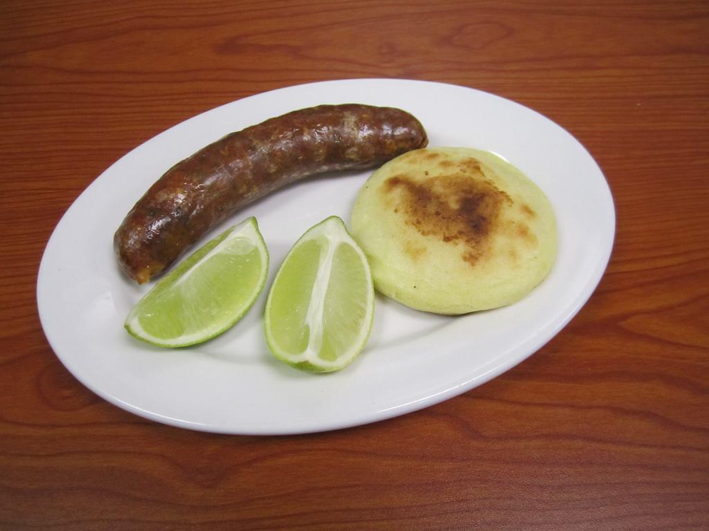 Colombian Chorizo Colombiano · Colombian sausage with arepa. 