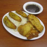 Mexican Pechuga Empanizada · Breaded chicken breast with rice, black beans and fried plantains. 