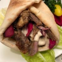 Five  Shawarma Wraps. · ON the Wrap: Marinated Beef or Chicken , Chopped Tomatoes, Chopped Red Onion, Hummus on Pita...