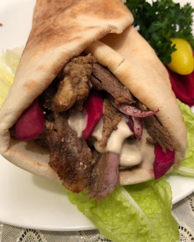 Five  Shawarma Wraps. · ON the Wrap: Marinated Beef or Chicken , Chopped Tomatoes, Chopped Red Onion, Hummus on Pita Bread topped with Tahini Sauce.
Note: please indicate in special instructions how many beef and how many chicken.