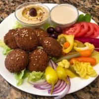 Falafel. · (8) Pieces of Falafel  served with Hummus, One (2) oz Container of Tahini and Hot Sauce,Lett...