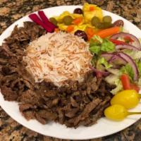 Shawarma & Rice. ·  Marinated Beef or Chicken served with White Basmati Rice, House Salad,Turshi ( Pickled Vege...