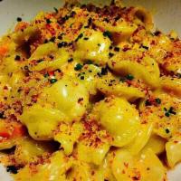 Lobster Mac ‘n Cheese · White cheddar, butternut squash, and herbed bread crumbs.