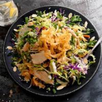 Asian Grilled Chicken Salad · Grilled chicken with crunchy noodles, almonds, sesame seeds, green onions, carrots and cilan...