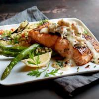 Salmon Oscar · Fresh salmon topped with lump crab meat and lemon butter. Served with choice of 2 sides. 