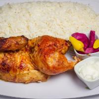 2. 1/2 Chicken · 1/2 rotisserie chicken served with basmati rice, turnips, garlic sauce and pita bread.