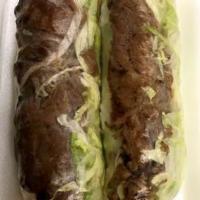 Grilled Pork Rolls · Our grilled pork wrapped in a clear rice paper with lettuce, cilantro, mint and noodles. Ser...