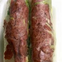 Grilled Pork Patties Rolls · Slightly sweet backed pink pork patties wrapped in clear rice pepper with lettuce, cilantro,...