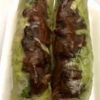 Grilled Beef Rolls · Our grilled beef wrapped in a clear rice paper with lettuce, cilantro, mint and noodles serv...