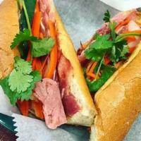 Classic Cold Cut Sandwich · Traditional Hanh mi with 3 types of pork based cold cuts ham, pork roll and head cheese on a...