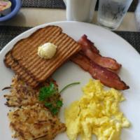 Thelma’s Breakfast · 2 fresh eggs, smoked Applewood bacon or sausage patties, toast.