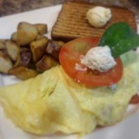 Healthy Basil Spinach and Goat Cheese Omelette · Fresh basil, spinach, heirloom tomatoes and goat cheese.