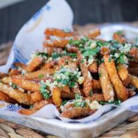 Garlic Fries · Crispy beer-battered fries, tossed in sauteed garlic and Parmesan cheese and topped with fre...