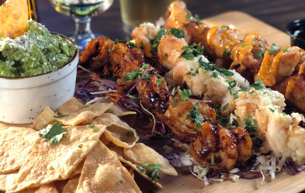 Shrimp Trio  · 18 Jumbo Prawns smothered into 3 of our favorite sauces: 6 Craft Beer-Battered to order prawns, 6 Garlic Butter, and 6 Chili Diablo prawns