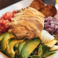 Cobb Salad · Grilled chicken, boiled egg, avocado, bacon bits, tomato, red onion, romaine, blue cheese dr...