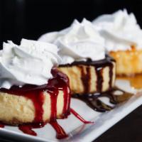 Cheesecake Trio · 3 peices of Cheesecake with chocolate, raspberry, and caramel sauces.