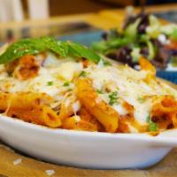 Baked Ziti · Penne pasta tossed with our signature marinara sauce and ricotta cheese, topped with mozzare...