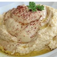 Hummus · A blend of chickpeas, tahini, with olive oil, and lemon juice.
comes with 1 pita bread
