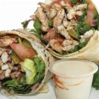 Chicken Shawarma Wrap · Thin slices of chicken marinated of special spices.