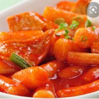 Dukbokki · Spicy pan-fried rice cake with vegetables, eggs, and fishcake